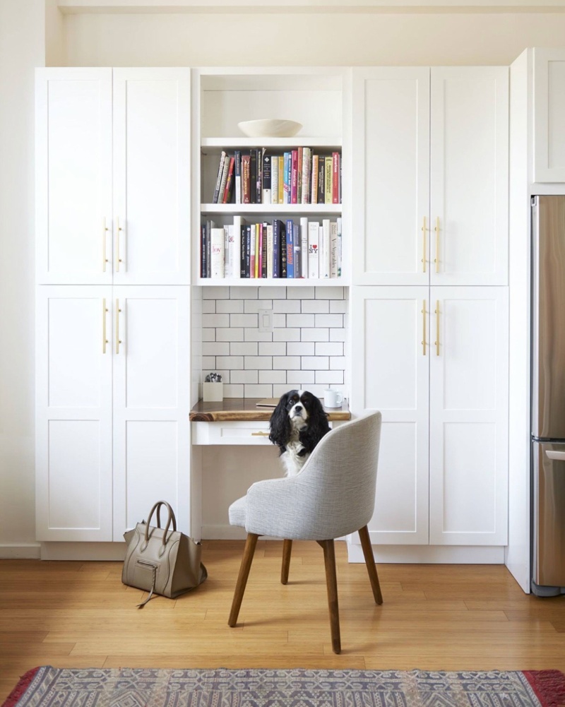 Nook style office in kitchen with subway tile