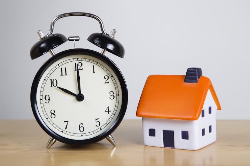 Alarm clock with small house