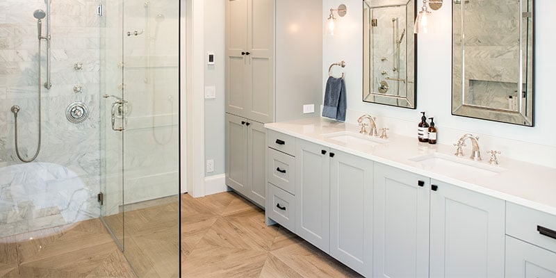 Bathroom with non-slip tile flooring that resembles wood parquet