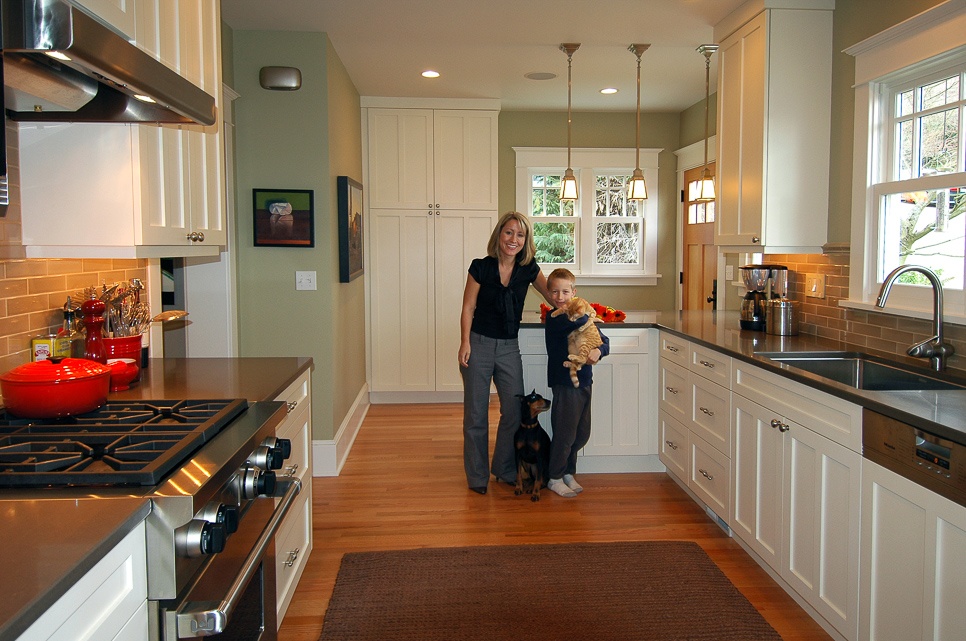A smiling family in a remodeled kitchen