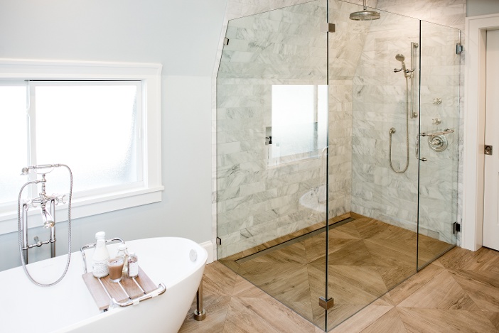 Wood grain tile in remodeled bathroom