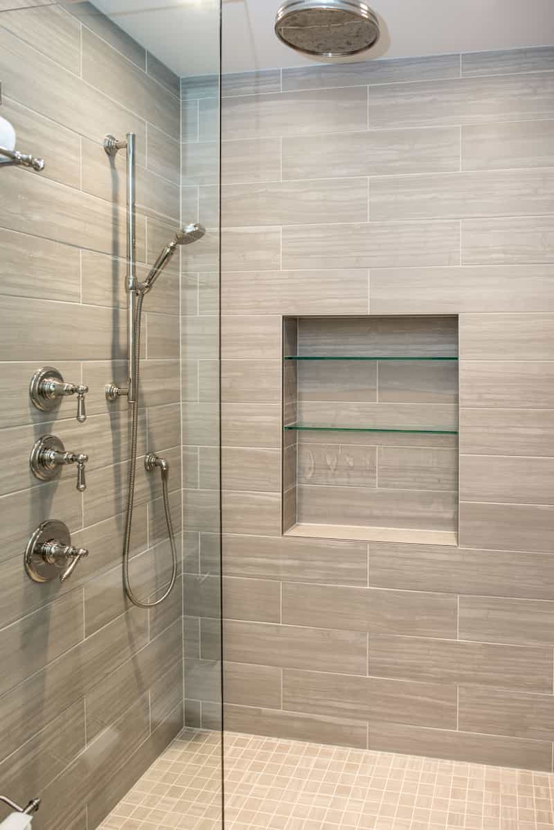 Luxury DADU Seattle builder - tile shower with glass divider