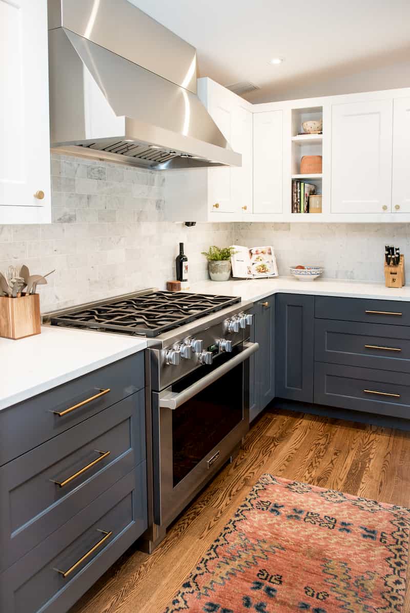 Kitchen with white quartz counters and blue-grey cabinets