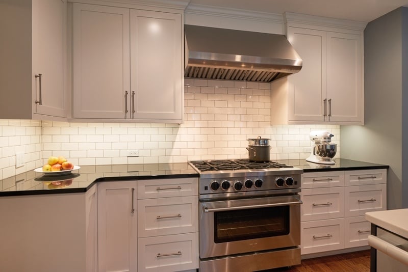 Kitchen with white shaker style cabinets