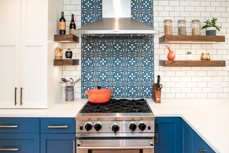 Kitchen with hand-made tile backsplash and open shelves