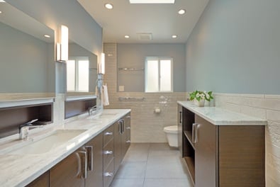 Photo of a master bath that shares a wall with a guest bath