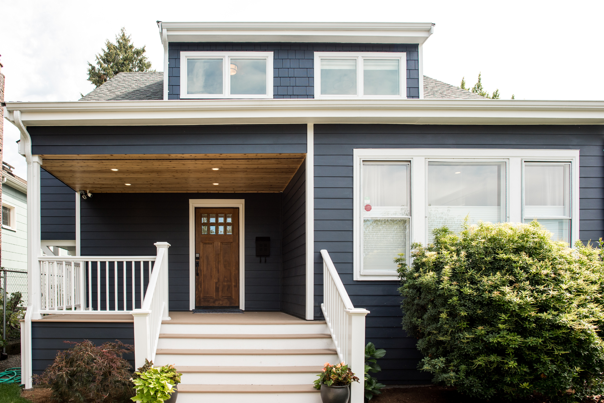 Explore the most popular house exterior paint colors that can enhance your curb appeal. Discover tips on choosing the right colors for your Seattle home and front door!
