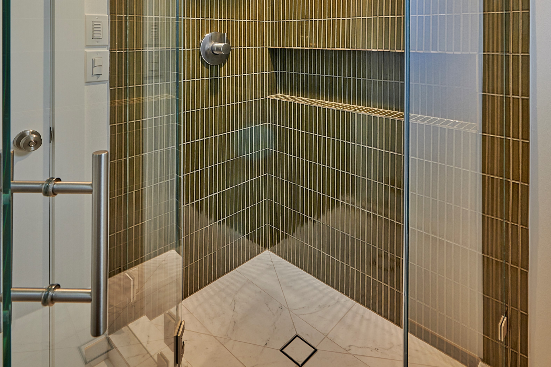 Revamp your bathroom with any of these stunning tile designs! Check out our designer-approved bath tile ideas that will elevate your space and inspire your next renovation.