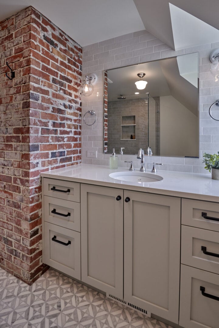 Remodeled bathroom with exposed brick