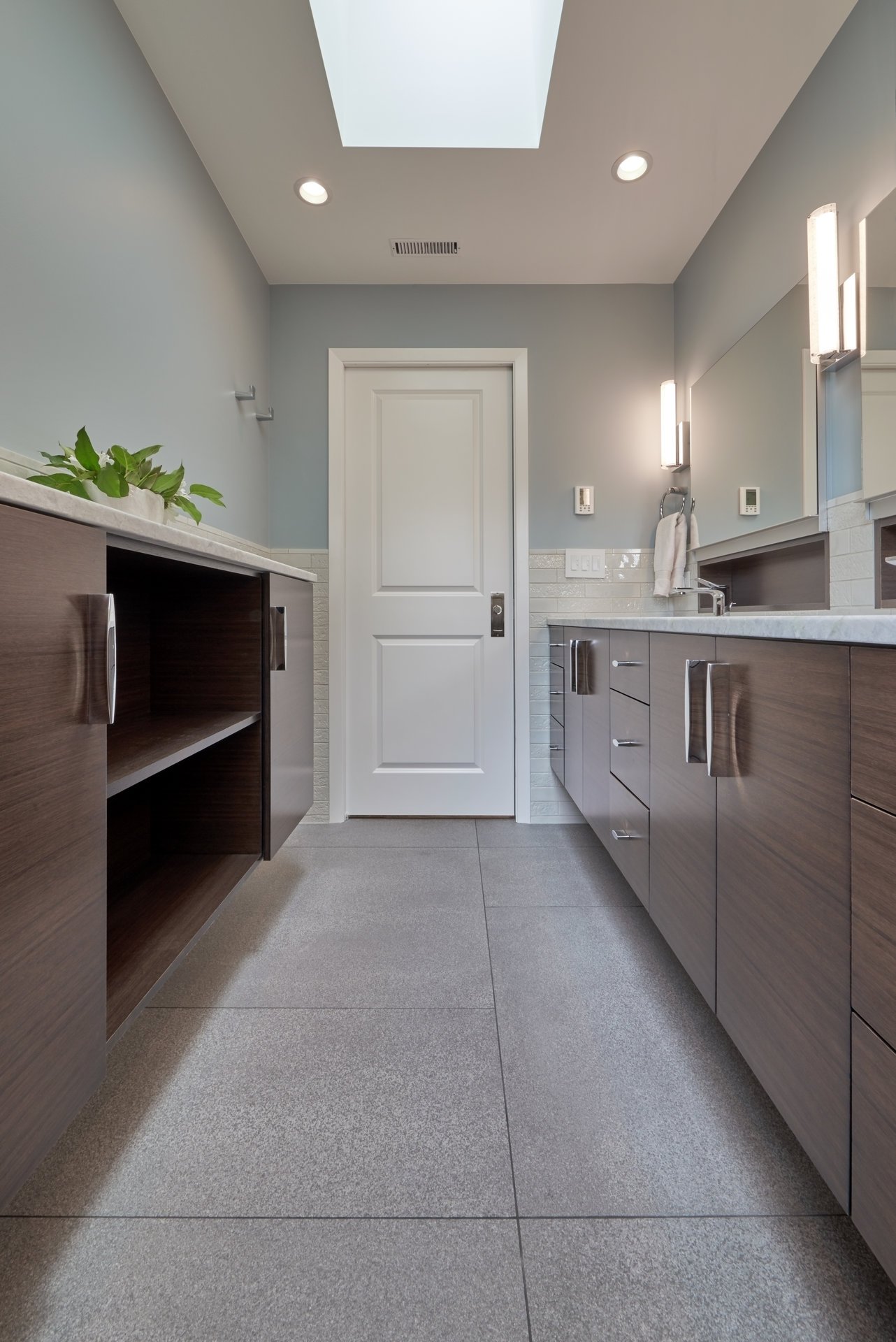 Enclosed shelving in a bathroom remodeled by CRD Design Build