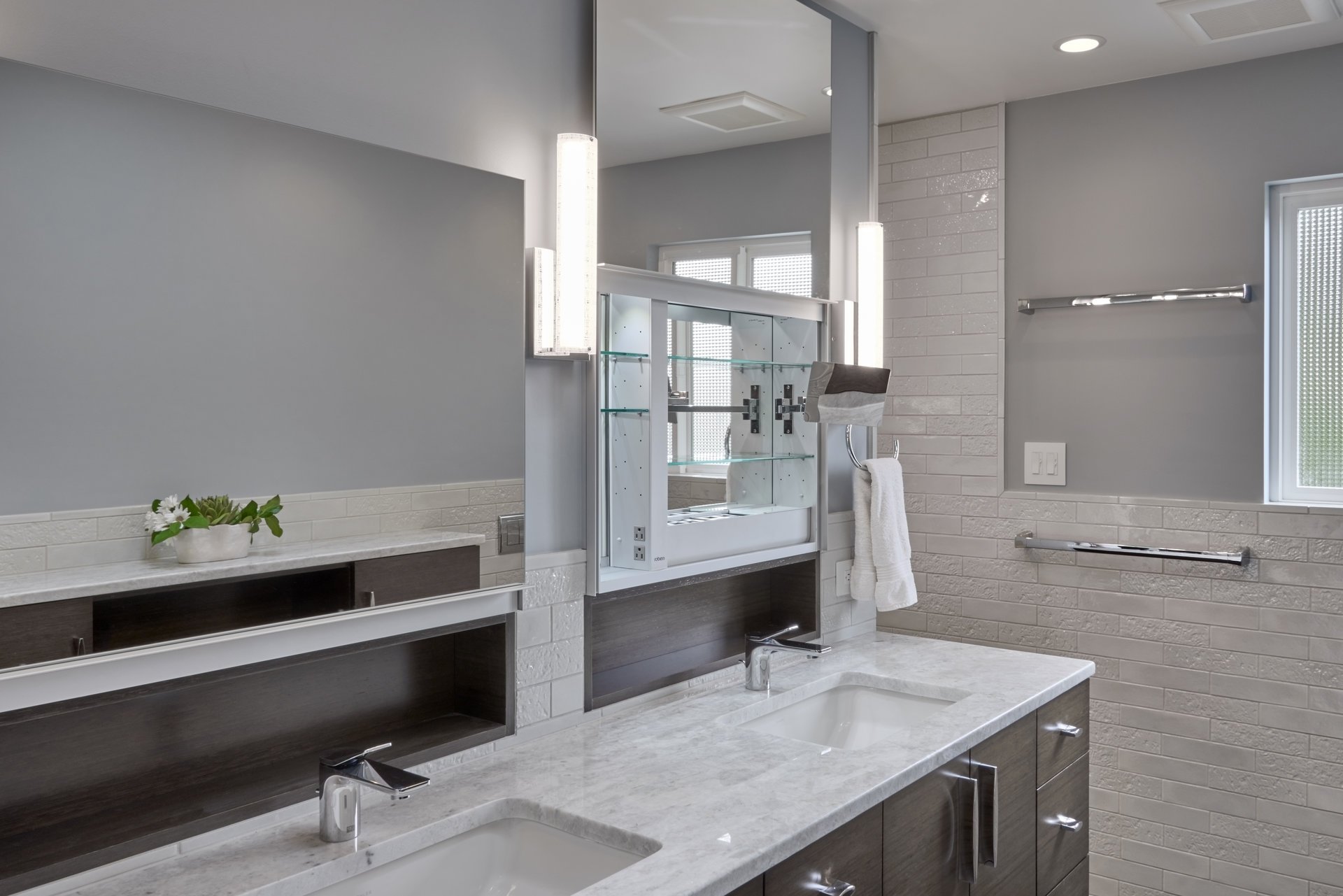 Storage behind a mirror in a bathroom