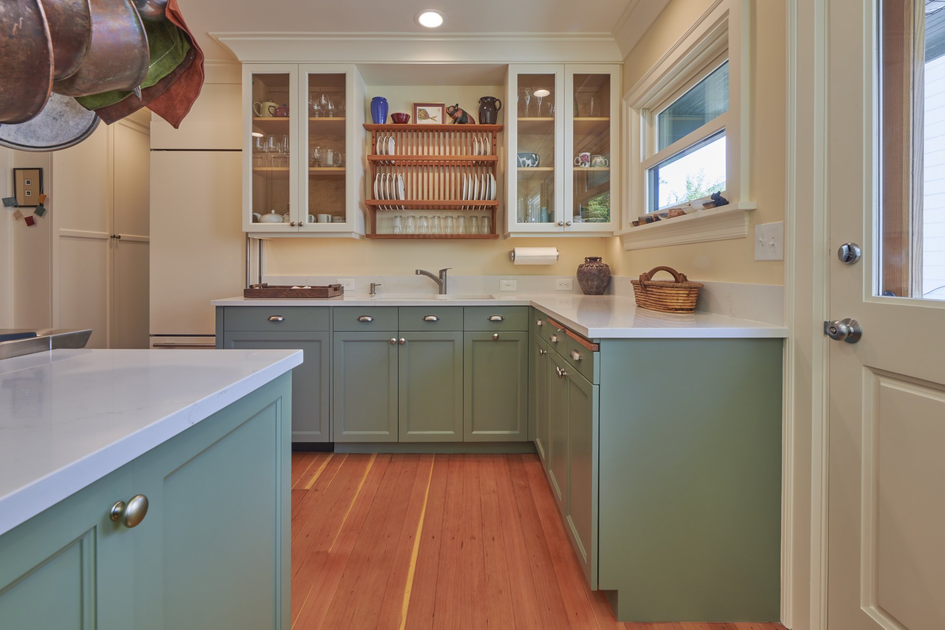 Kitchen with sage green cabinets