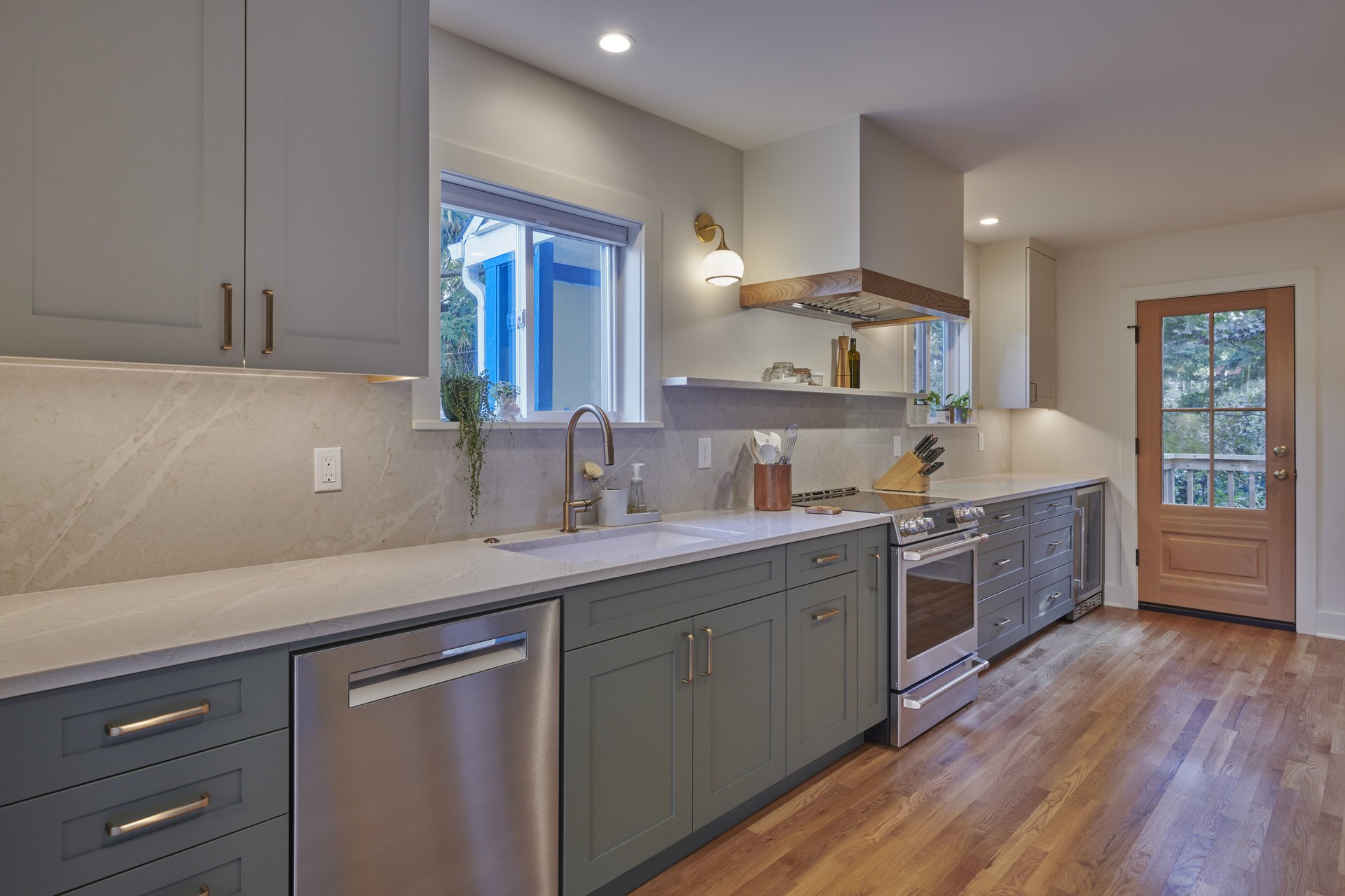 Remodeled kitchen in Loyal Heights Seattle, with sage green cabinetry