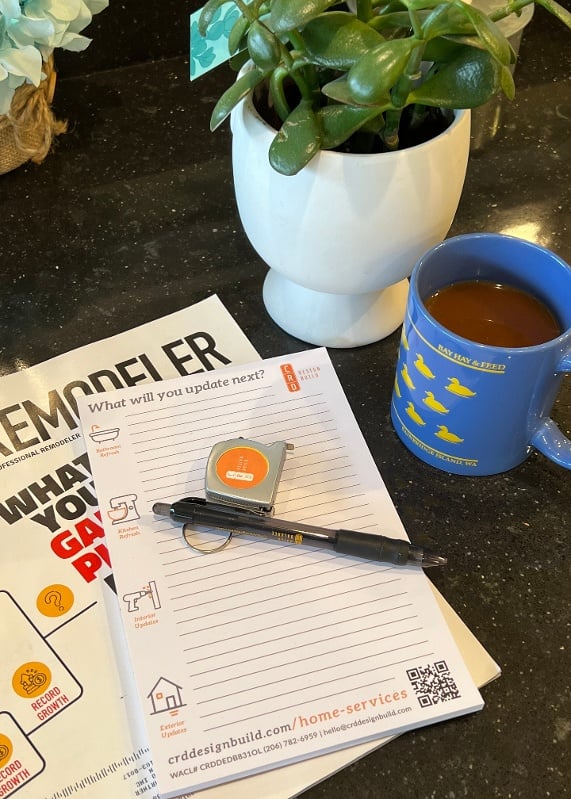 CRD jotter, pen and a mug of coffee