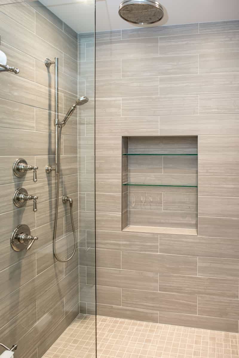 10 Durable Bathroom Materials 3 Luxury DADU Seattle builder - tile shower with glass divider