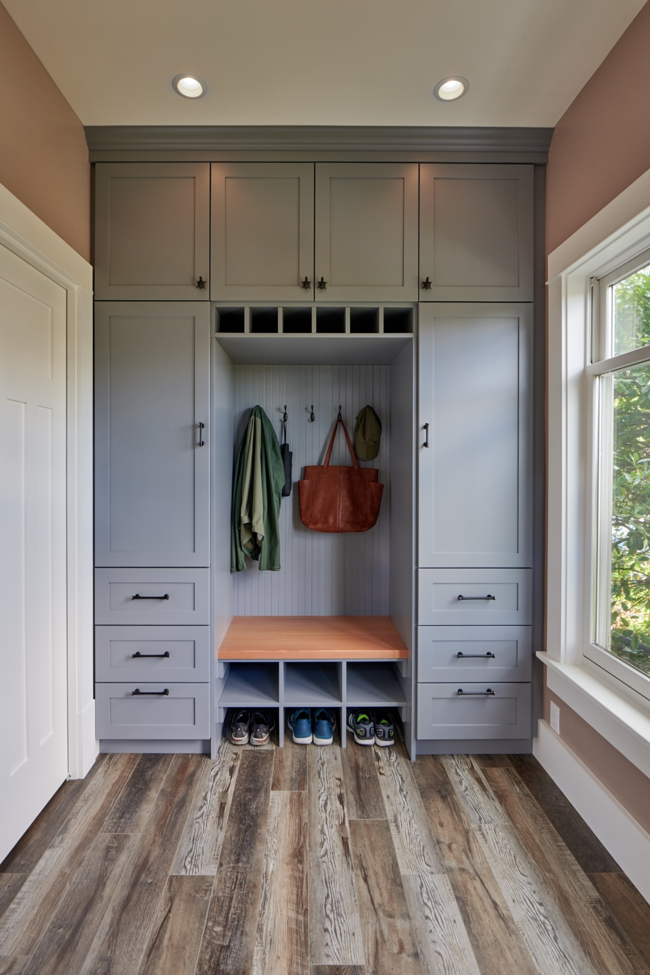 In Seattle, a mudroom isn't a luxury, it's practically a survival strategy. Here's how to design an entry that handles everything the Pacific Northwest throws at it, with ideas from compact built-ins to full mudroom additions.