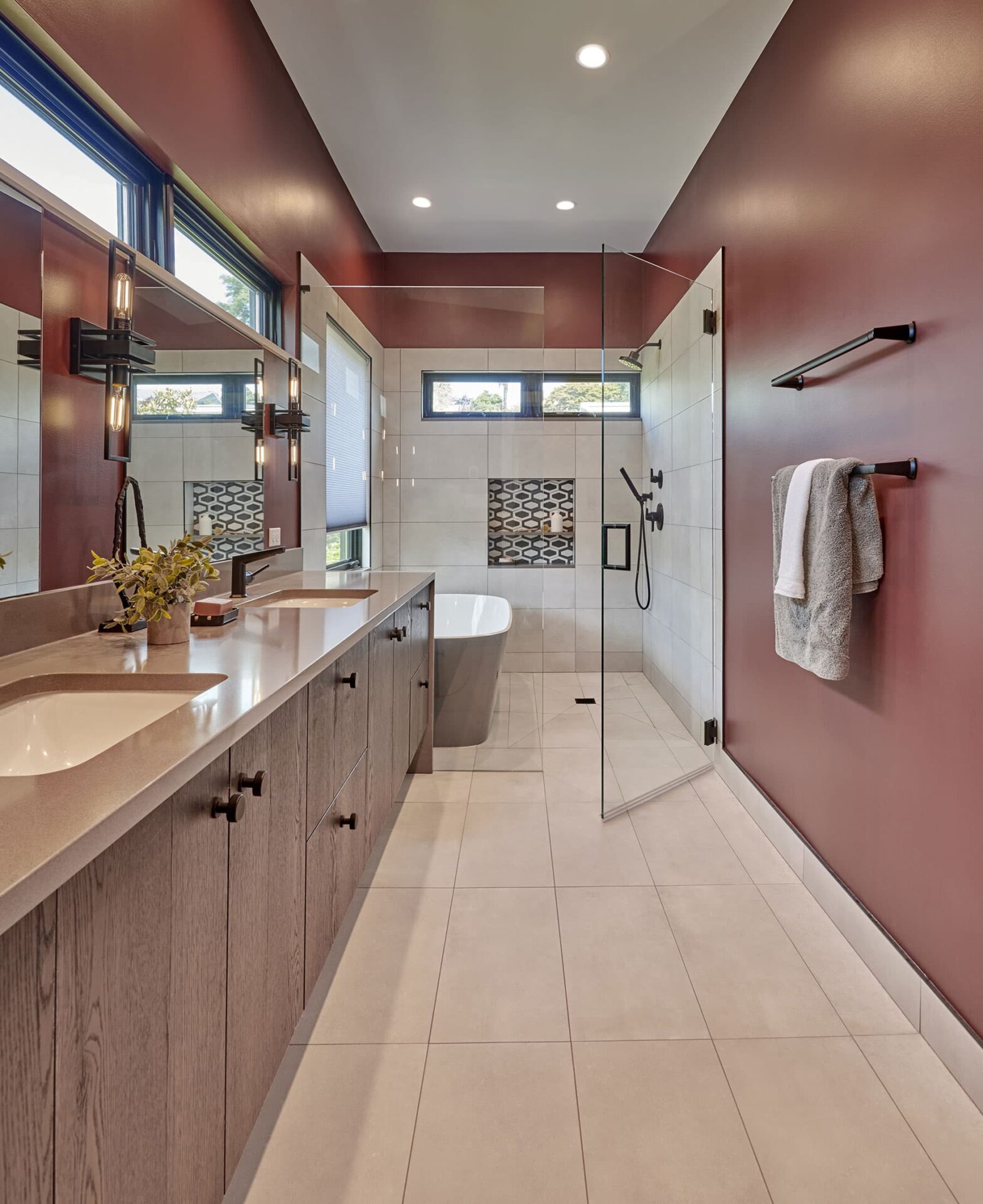 Curbed Bathroom With A Bathtub and Double Vanities
