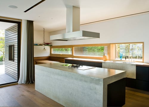 Concrete kitchen countertop with an industrial vent overhead