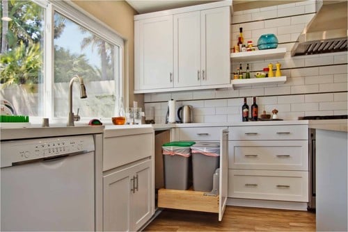 What To Do with the #%$@ Kitchen Corner Cabinet: Top Corner Cabinet Ideas 6 Wooden kitchen cabinets with a plastic trash bins