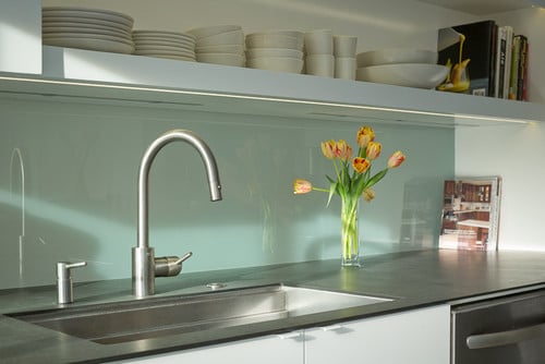 Water faucet and taps installed over a kitchen sink